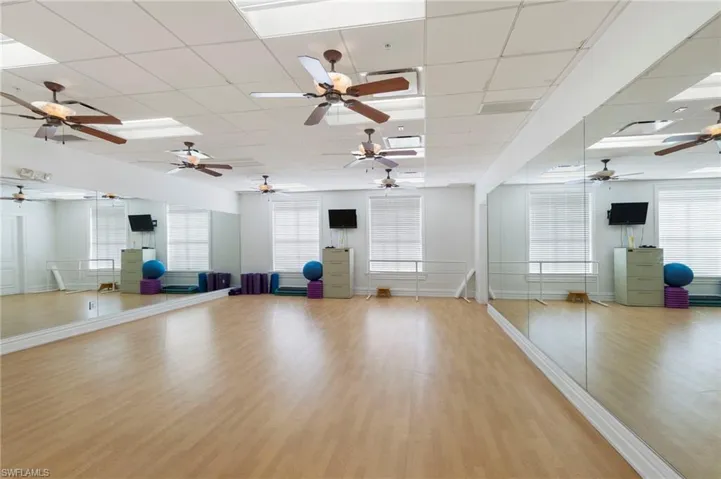 Workout area featuring a paneled ceiling