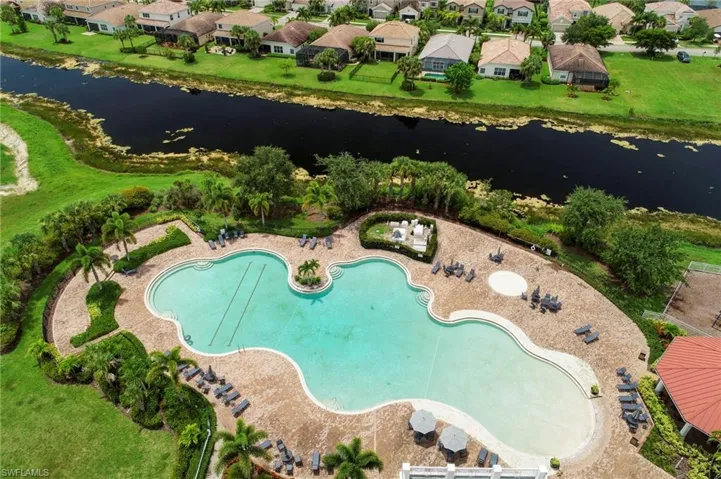 Aerial perspective of suburban area with a nearby body of water