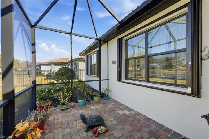 Unfurnished sunroom with a patio and plenty of natural light