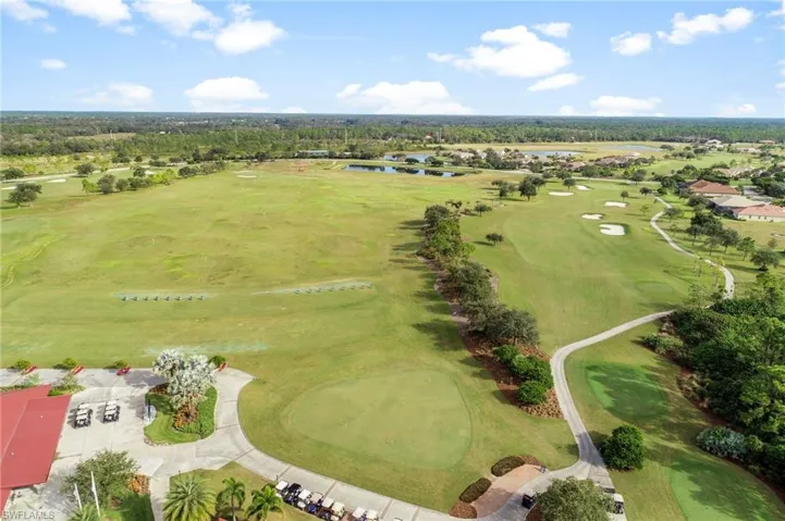 Aerial view of a golf club and a nearby body of water