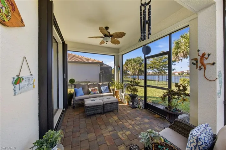 Sunroom / solarium featuring a ceiling fan and outdoor seating
