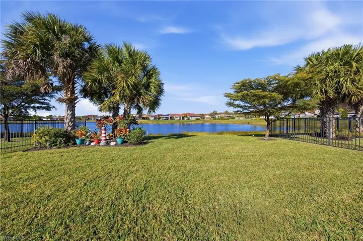 View of yard with a water view