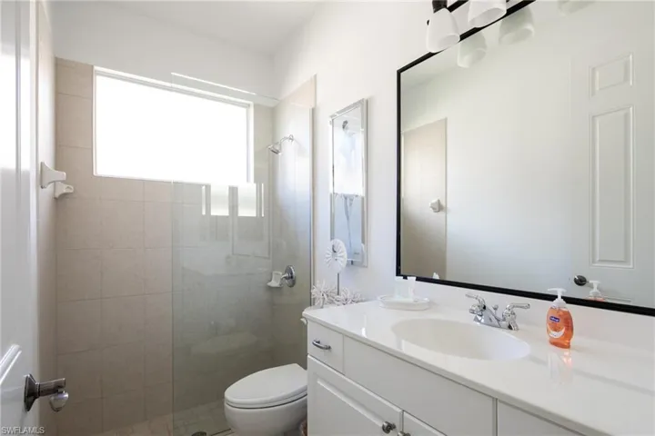 Full bathroom with vanity and walk in shower