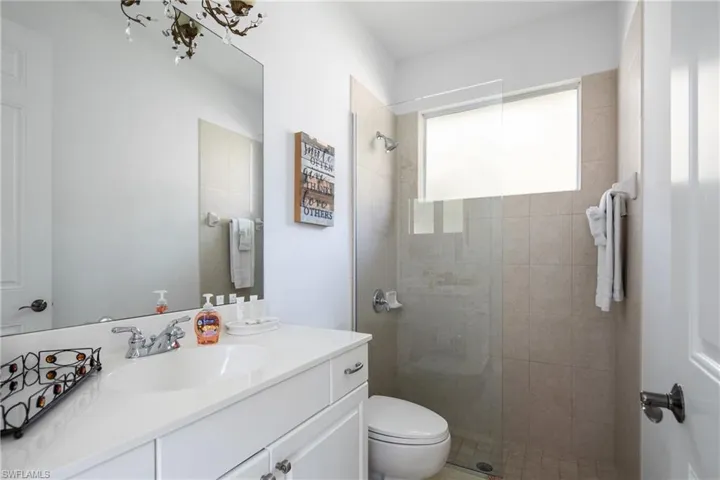 Bathroom featuring vanity and walk in shower