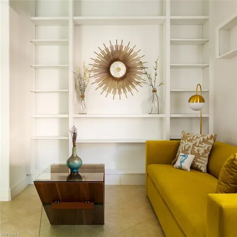 Sitting room with tile patterned floors and built in features