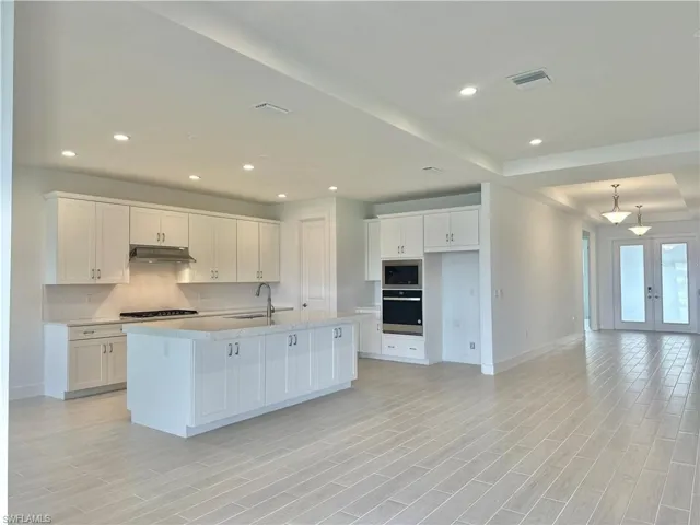 Open-concept kitchen and great room with double-entry front door and spacious foyer