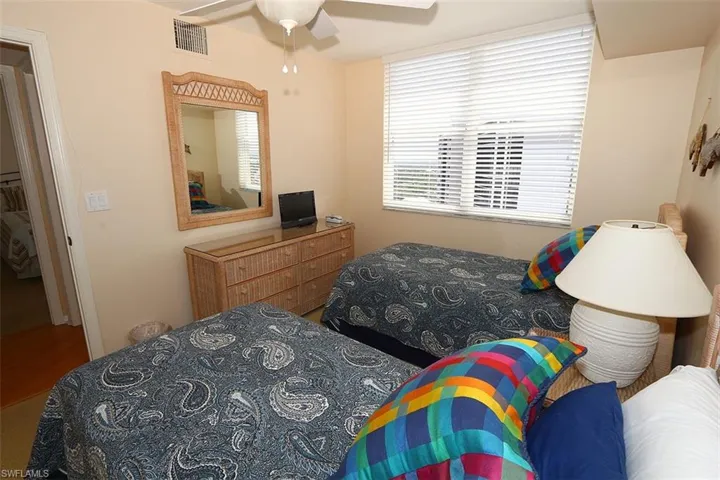 Bedroom featuring wood-type flooring and ceiling fan