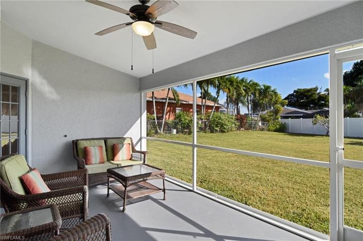 Lanai overlooks the oversized  fenced back yard