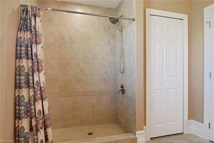 Large  tiled walk in shower in guest bath