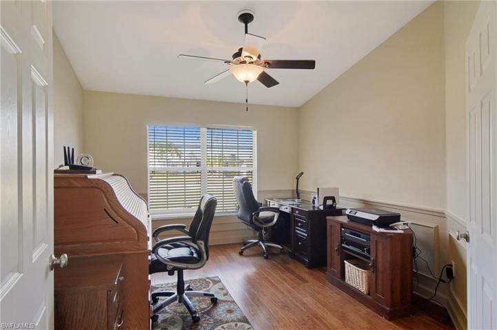 Spacious Den with double doors and bamboo floors