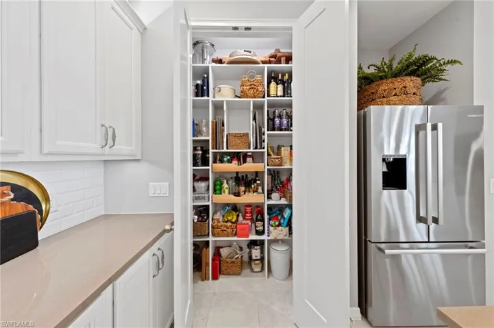 Pantry maximizes available storage with custom shelving. New added CAN LIGHTING (September 2023), new CUSTOM CLOSET ORGANIZERS (February 2022)