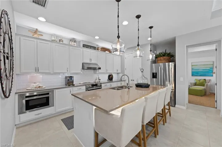 Kitchen features thoughtful storage, MICROWAVE DRAWER, EXTERNALLY VENTED HOOD, CONVECTION RANGE, and WARMING DRAWER. New UNDER CABINET/OVER CABINET & UNDER ISLAND LIGHTING (September 2023), all new BOSCH APPLIANCES (January 2023), new PENDANTS (November 2021)