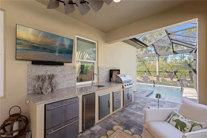 New OUTDOOR KITCHEN (May 2022) with 5 burner gas grill, refrigerator drawers (2), sink, ice maker, and new TV MOUNT & RAISED OUTLET (November 2021)