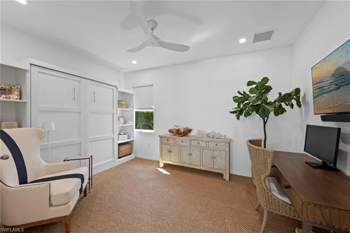 Large den/THIRD BEDROOM set-up as an office. New added CAN LIGHTING (September 2023), new SISAL CARPET (February 2022), new CEILING FAN (January 2022), new WINDOW BLINDS (November 2021), new TV MOUNT & RAISED OUTLET (November 2021)