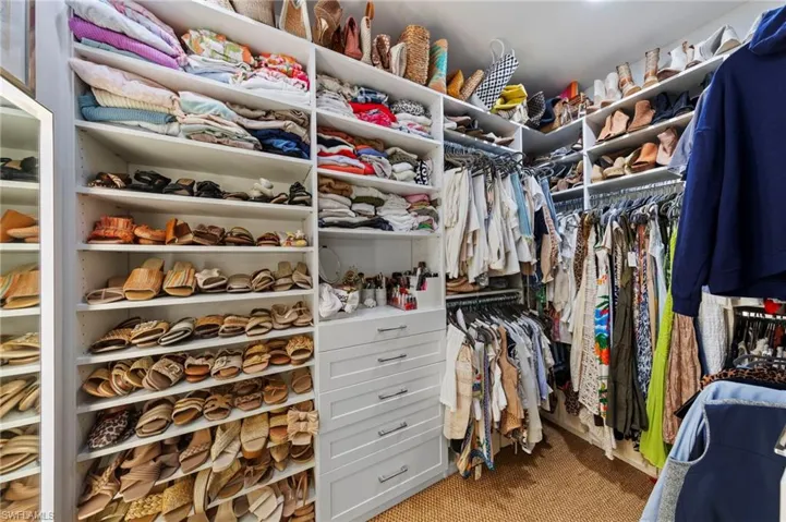 Spacious closet. New added CAN LIGHTING (September 2023), new LIGHTED FULL MIRROR on DEDICATED SWITCH (September 2023), new CUSTOM CLOSET ORGANIZERS (February 2022), new SISAL CARPET (February 2022)