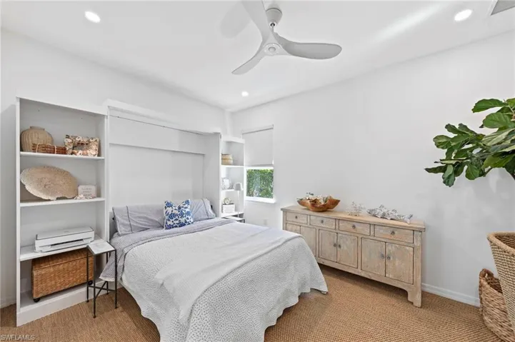 Versatile THIRD BEDROOM/DEN featuring a MURPHY BED. New added CAN LIGHTING (September 2023), new SISAL CARPET (February 2022), new CEILING FAN (January 2022), new WINDOW BLINDS (November 2021), new TV MOUNT & RAISED OUTLET (November 2021), new MURPHY BED (2021)