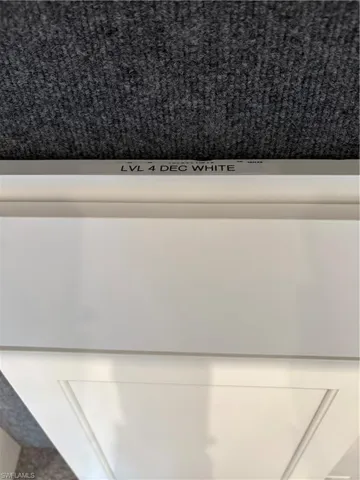 Level 4 Decatur white wood cabinets throughout