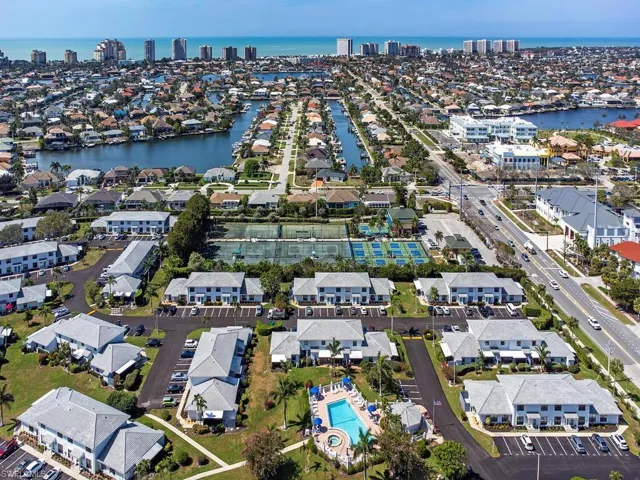 Birds eye view of property with a water view
