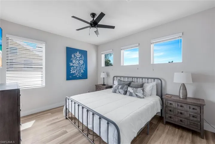 Bedroom with light wood-style flooring and ceiling fan