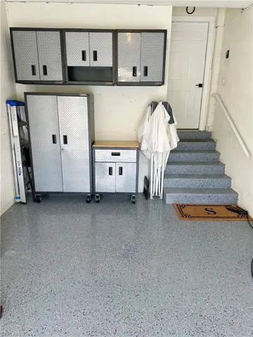 Mudroom featuring concrete block wall