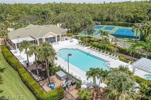 Community pool featuring a patio