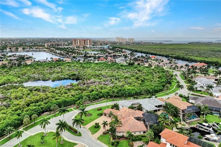 Birds eye view of property with Cape Harbour, Tarpon Point and the Gulf of Mexico in the background.