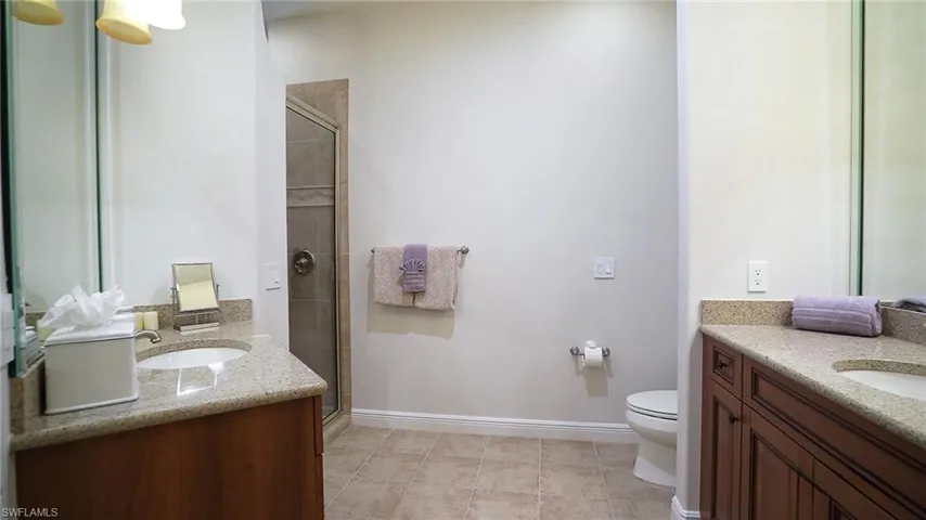 Ensuite Bathroom for 5th bedroom with walk in shower and dual vanities.