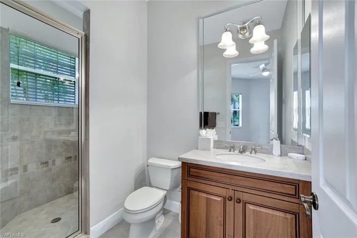 2nd bedroom ensuite bathroom featuring a walk in shower