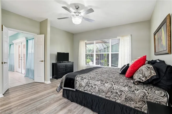 Bedroom with light wood-style floors and ceiling fan