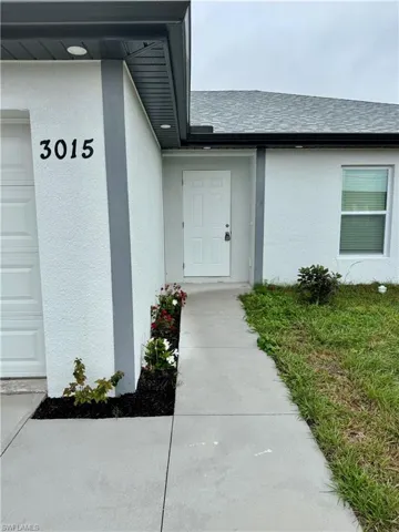 Property entrance with a garage