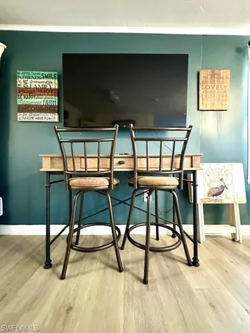 Dining area featuring wood finished floors and baseboards