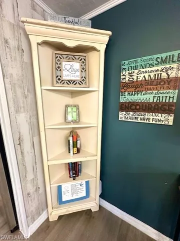 Detailed view of wood finished floors and baseboards