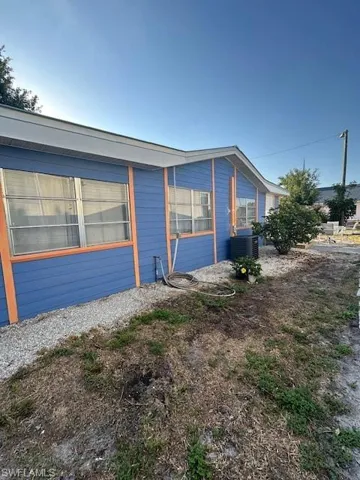 View of home's exterior featuring central AC