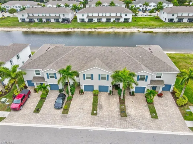 Aerial view of residential area featuring a large body of water
