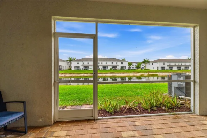 Unfurnished sunroom featuring a water view and healthy amount of natural light