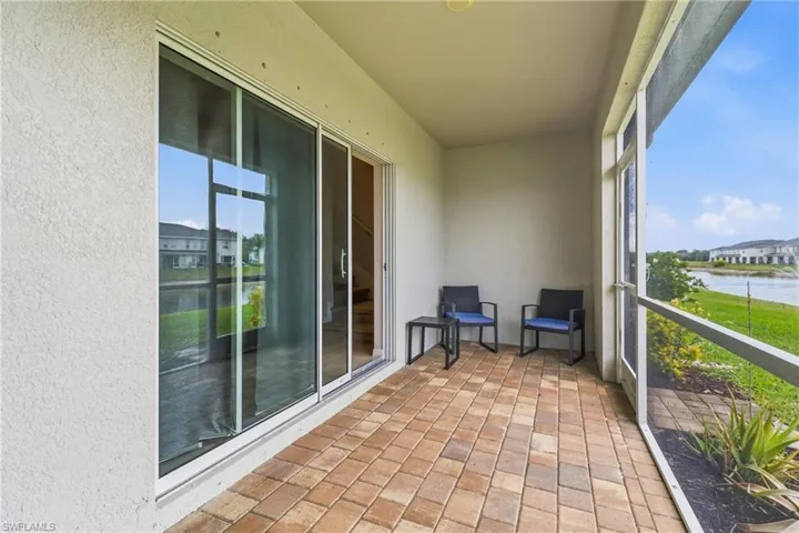 Sunroom / solarium with a water view