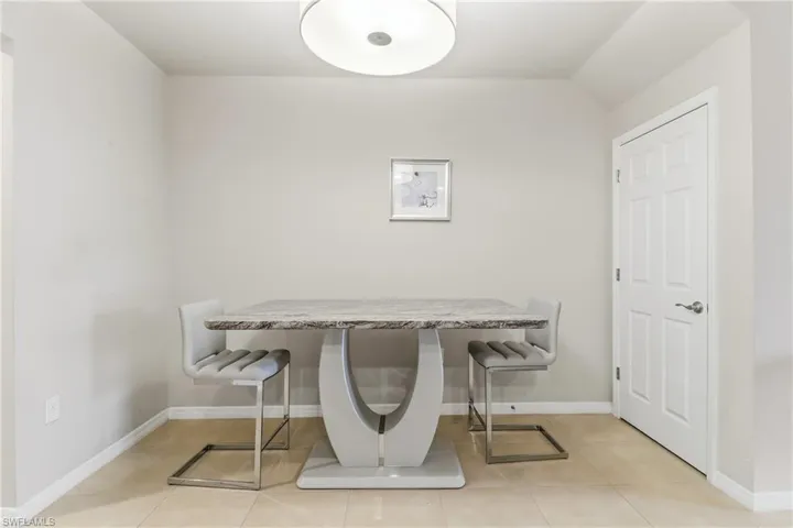 Dining room featuring baseboards and light tile patterned floors
