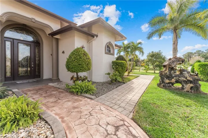Property entrance with a yard