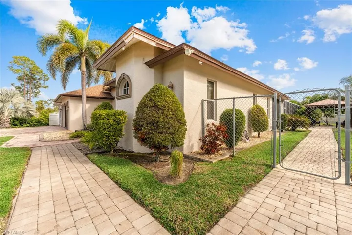 View of property exterior with a garage