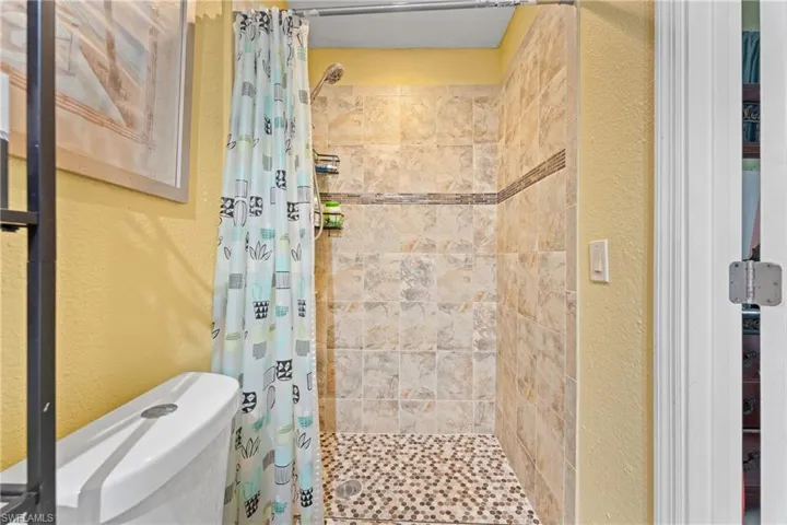 Bathroom featuring toilet and walk in shower