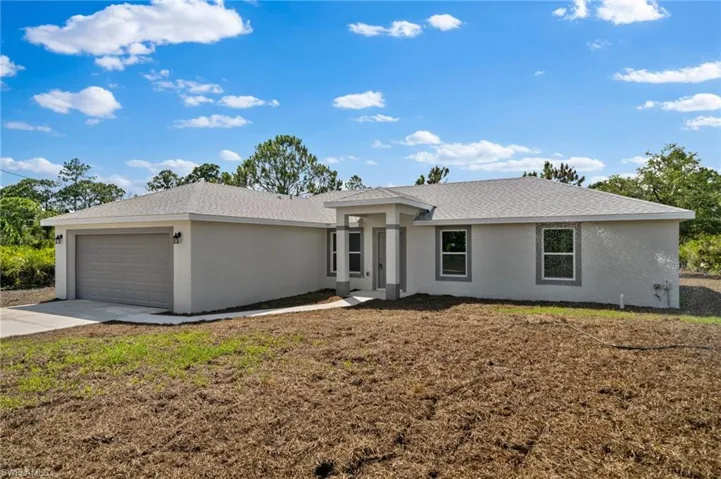 Single story home with a garage