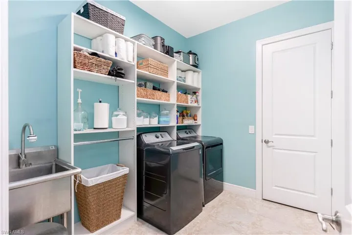 Custom Laundry Room with Additional Storage closet