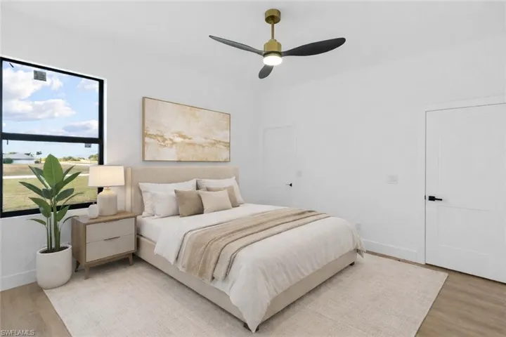 Bedroom featuring light wood finished floors and a ceiling fan