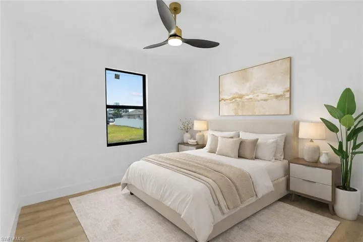 Bedroom featuring light wood-type flooring and ceiling fan