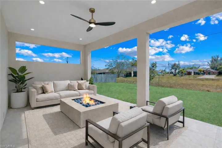 View of patio / terrace featuring an outdoor living space with a fire pit and ceiling fan