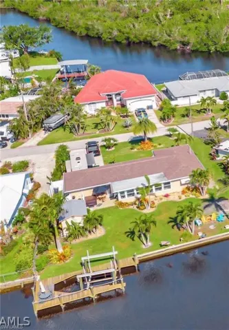 Drone / aerial view featuring a water view and a residential view