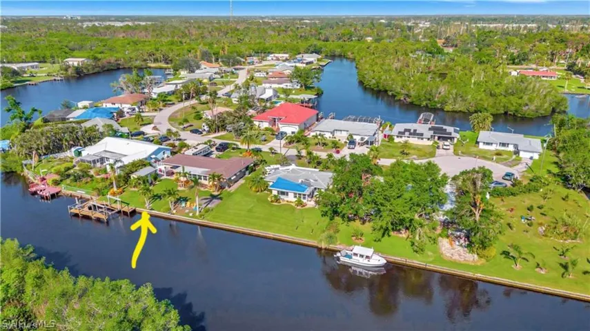 Drone / aerial view featuring a water view and a residential view