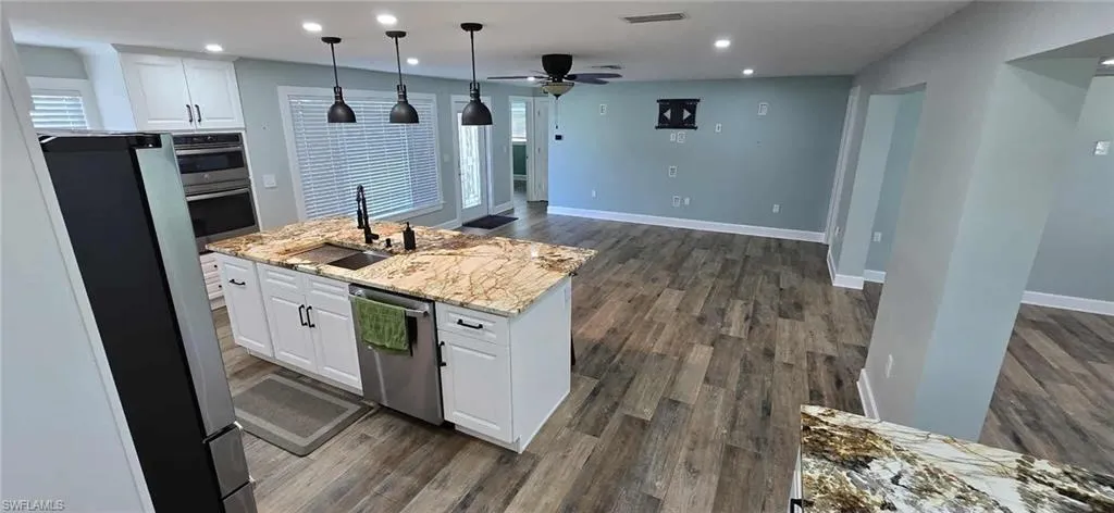 Kitchen featuring stainless steel appliances, a sink, visible vents, recessed lighting, and a ceiling fan
