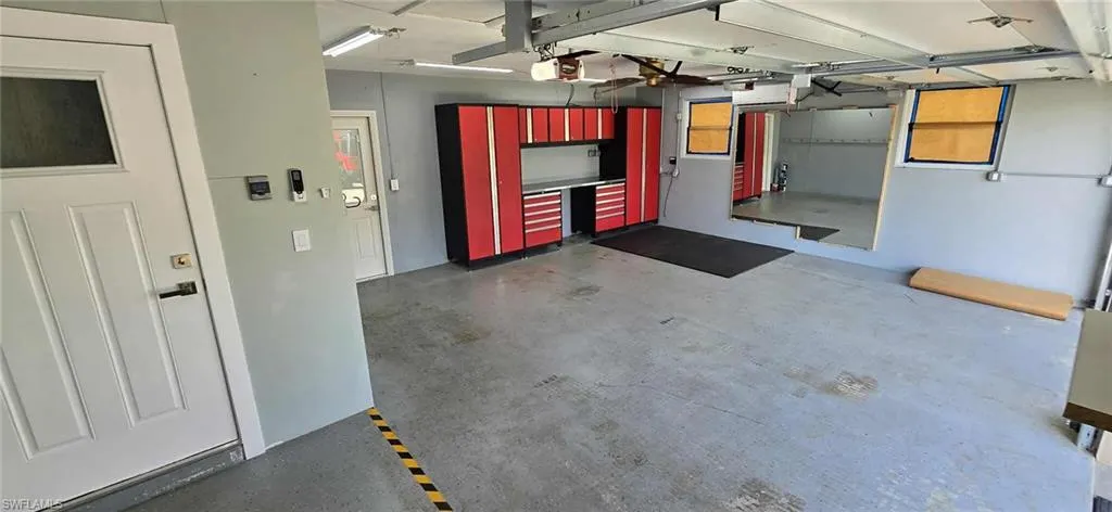 Garage featuring a garage door opener