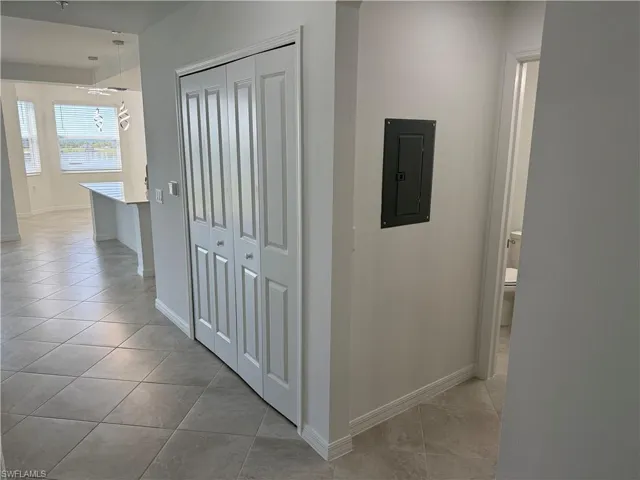 Hallway to living room, dining area, and kitchen